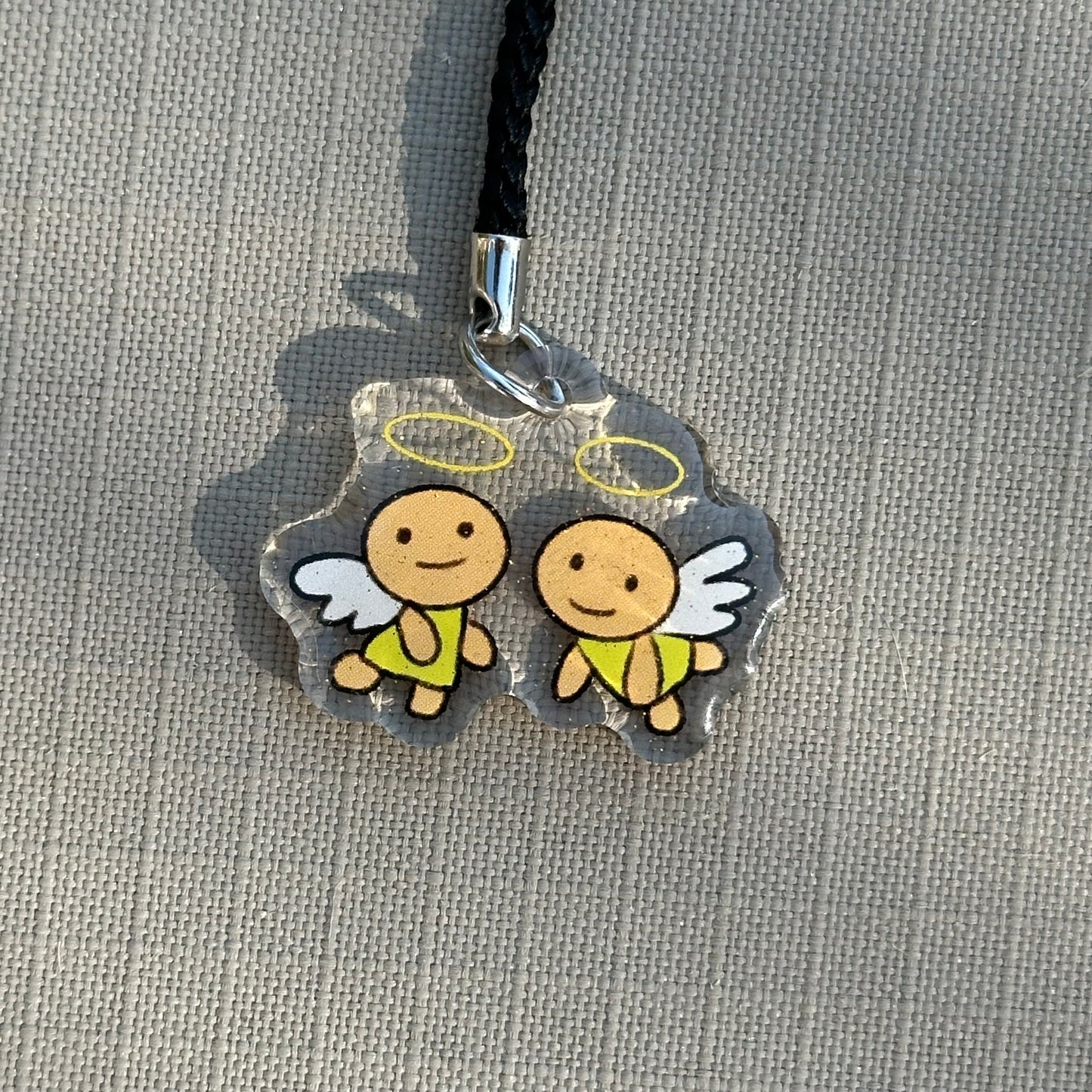 tama angels phone charm
